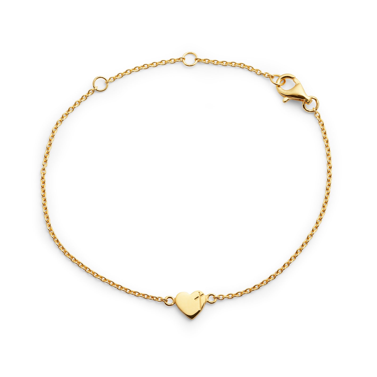 Armband med hjärta och ett kors på vit bakgrund